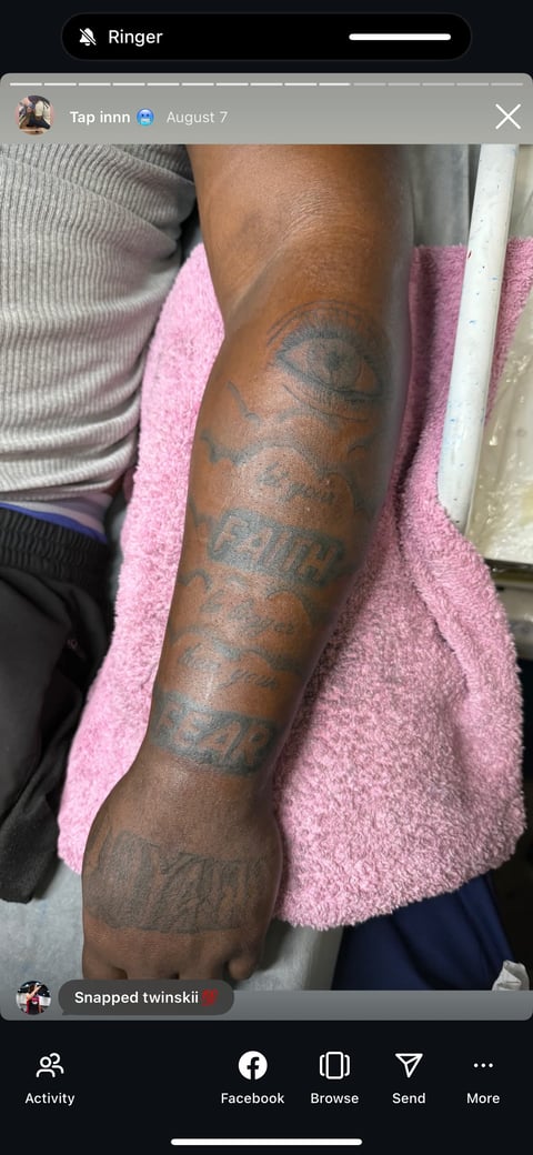 Person displaying arm with multiple tattoos while wearing pink towel, posted on Ringer app